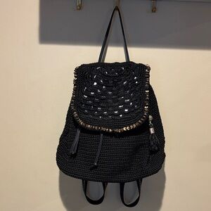 The Sak Black Crochet Backpack with Gold Accents